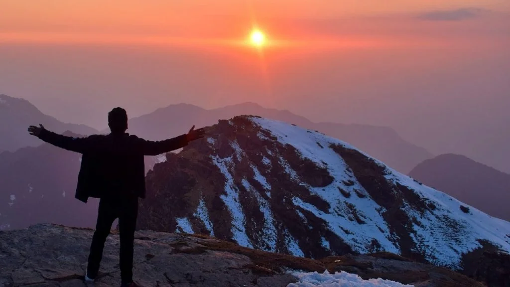 Traveler welcomes sunrise over snow-capped peaks in MyHillTour Hill Station Traveling Banner of Uttarakhand adventure.
